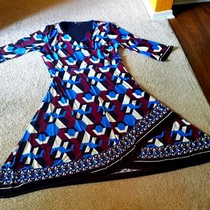 Bold and striking for curvy ladies..  INC 1x faux wrap dress very flattering